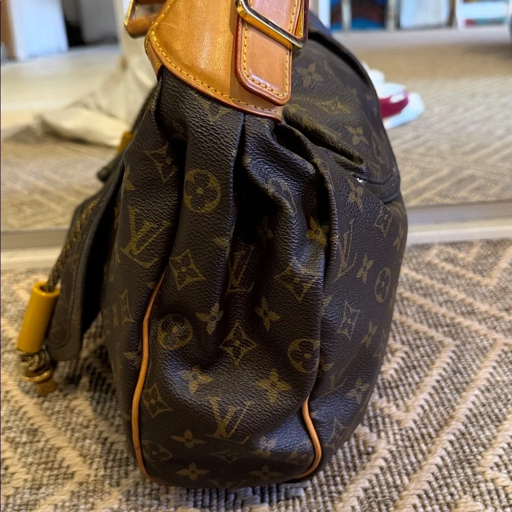 Louis Vuitton Brown Monogram Drawstring Shoulder Bag circa 2009